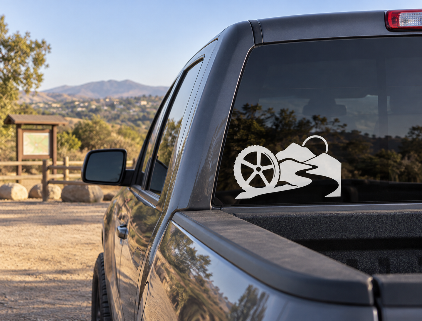 Vinyl bicycle icon decal sticker on car rear window, black and white trail bike graphic
