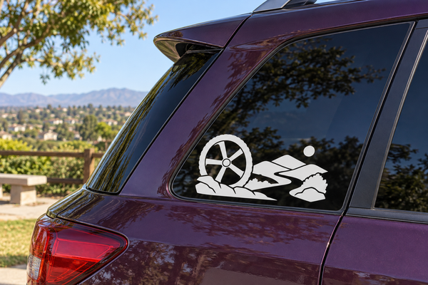 Horizon vinyl decal with white bicycle wheel and trail rider graphic on car window