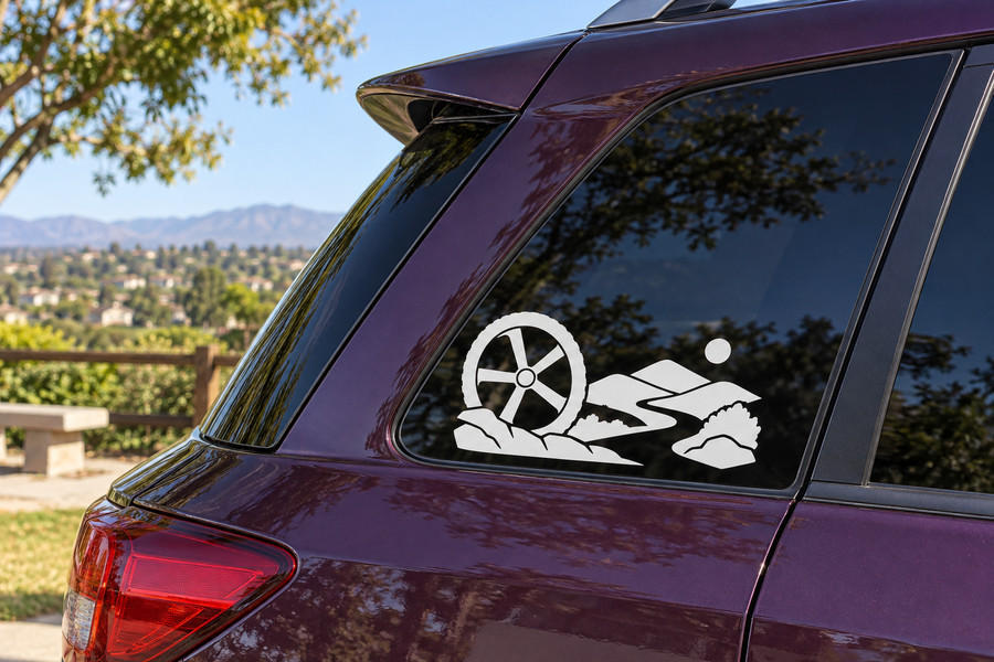 Horizon vinyl decal with white bicycle wheel and trail rider graphic on car window