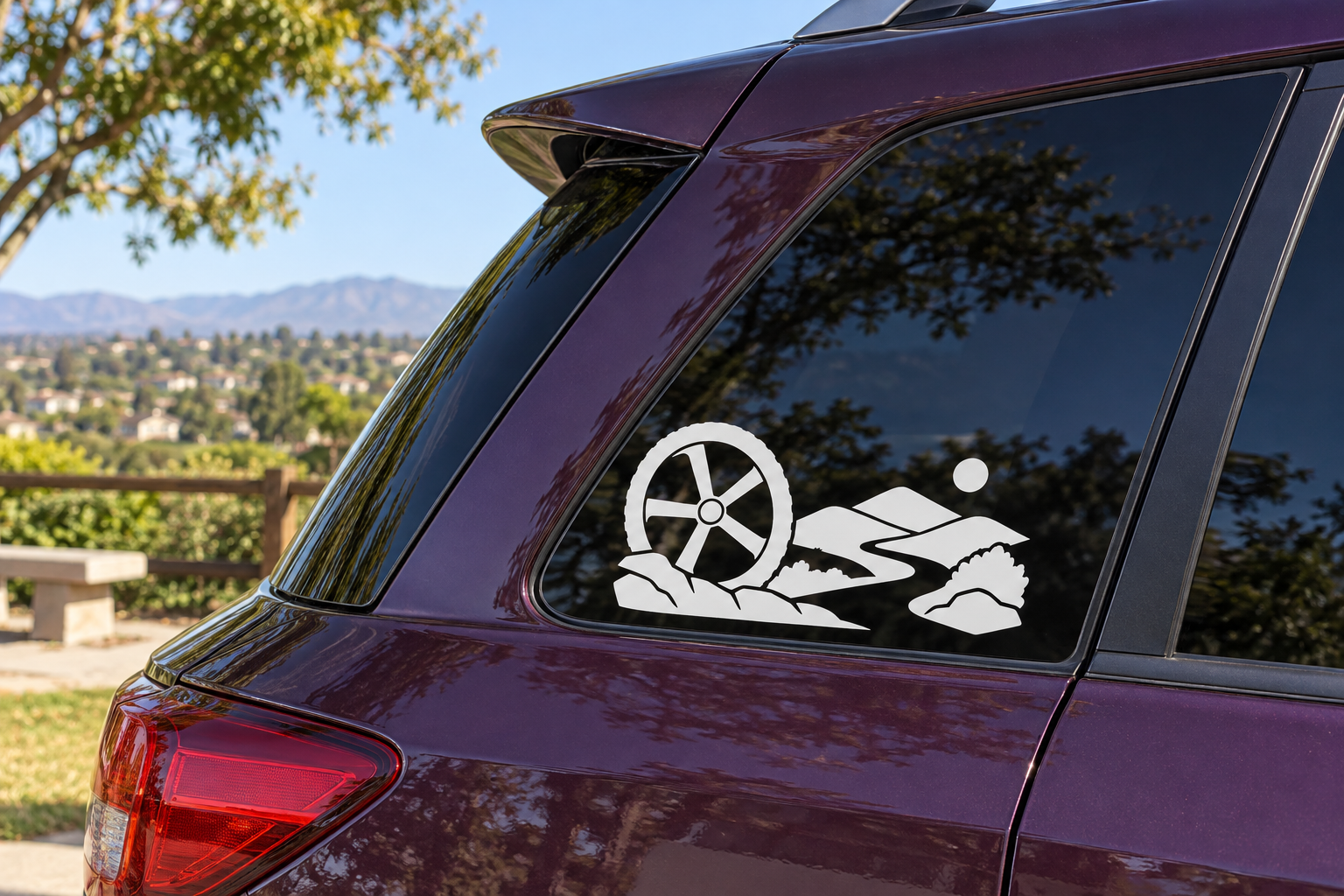 Horizon vinyl decal with white bicycle wheel and trail rider graphic on car window