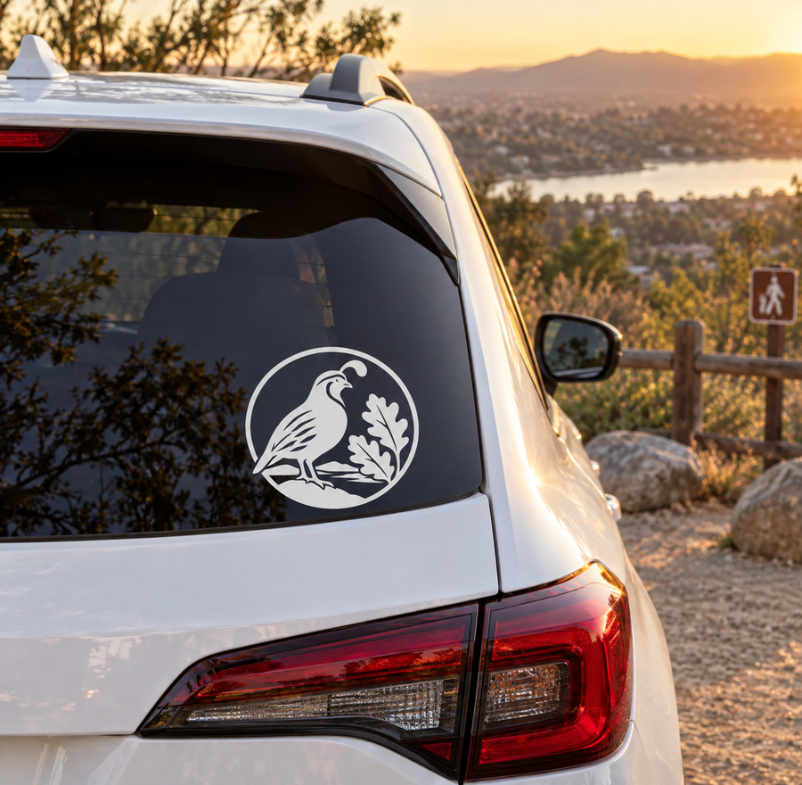 Quail crest vinyl decal on rear window of a white car