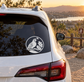 Quail crest vinyl decal on rear window of a white car