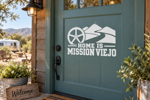 White Mission Viejo home lettering vinyl decal with mountain and wheel graphic on door