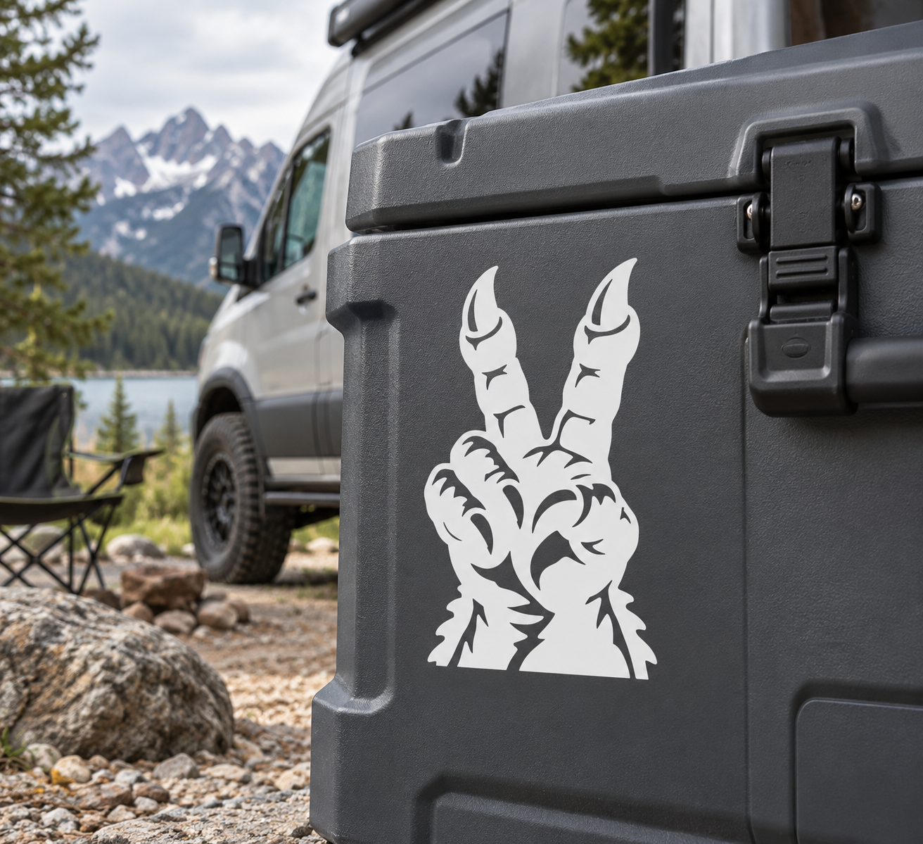 White vinyl decal of clawed peace sign on dark case