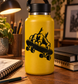 Black monster-hand skateboard vinyl decal on yellow bottle