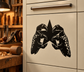 Black scaled-hand star vinyl decal on light cabinet drawer front