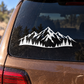 Vinyl car rear window decal with snowy mountain peaks and pine trees