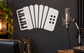 Accordion vinyl music decal with white keys and dot buttons on black shapes