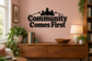 Vinyl wall decal: 'Community Comes First' arched text with family silhouettes and stars