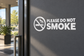 No smoking vinyl decal icon with crossed cigarette and 'PLEASE DO NOT SMOKE' text