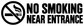 No smoking near entrance vinyl decal with black no-smoking circle and bold lettering