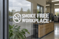Smoke-free workplace vinyl wall decal with no-smoking symbol and wide lettering, white