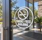 Smoke-free building vinyl decal, white circle with no-smoking symbol and text on glass