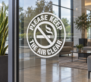 Circle vinyl decal with 'Please Keep The Air Clear' and no-smoking symbol on glass