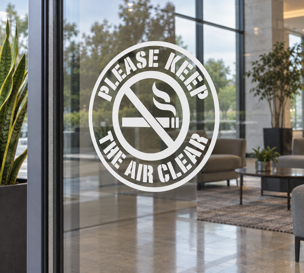 Circle vinyl decal with 'Please Keep The Air Clear' and no-smoking symbol on glass