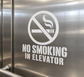 No smoking in elevator vinyl decal with crossed cigarette icon and text