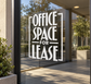White vinyl window decal: bold “OFFICE SPACE FOR LEASE” lettering.
