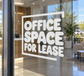 Vinyl wall decal with stacked text: OFFICE SPACE FOR LEASE, white letters on glass