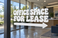 White directional vinyl decal reading “OFFICE SPACE FOR LEASE” with right arrow