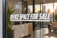 Horizontal vinyl decal: 'OFFICE SPACE FOR SALE' on glass window