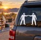 Vinyl decal of two masked paintball players high-fiving on a car rear window.