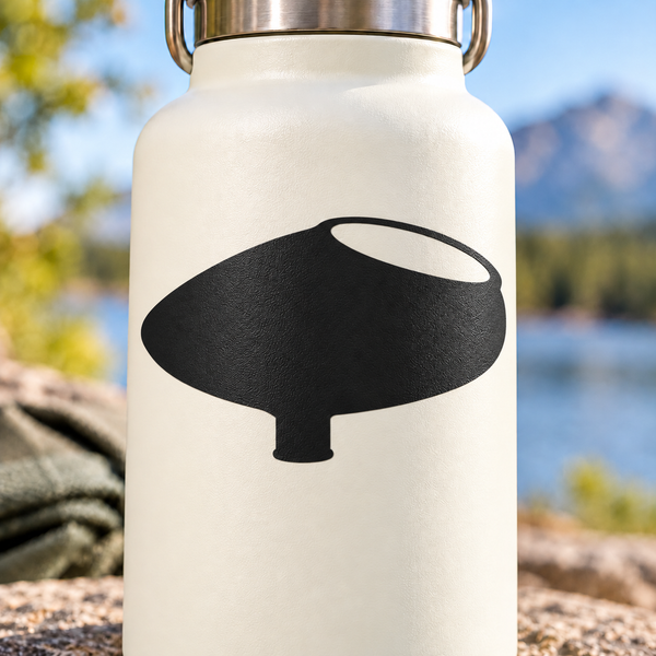 Paintball hopper emblem vinyl decal with black symbol on light surface