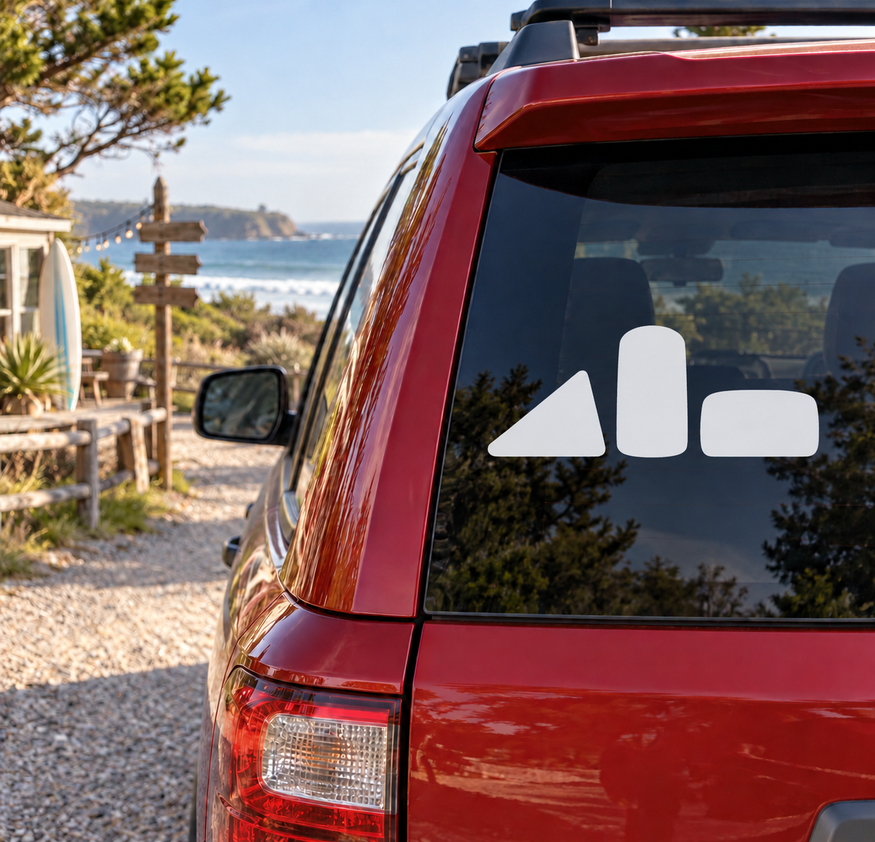 Vinyl decal set with three white paintball bunker shapes on rear window of vehicle