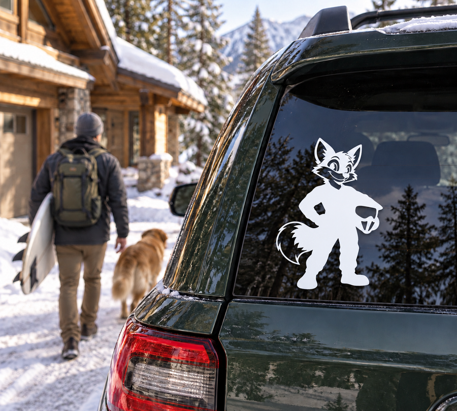 White fox character vinyl decal on dark car window glass