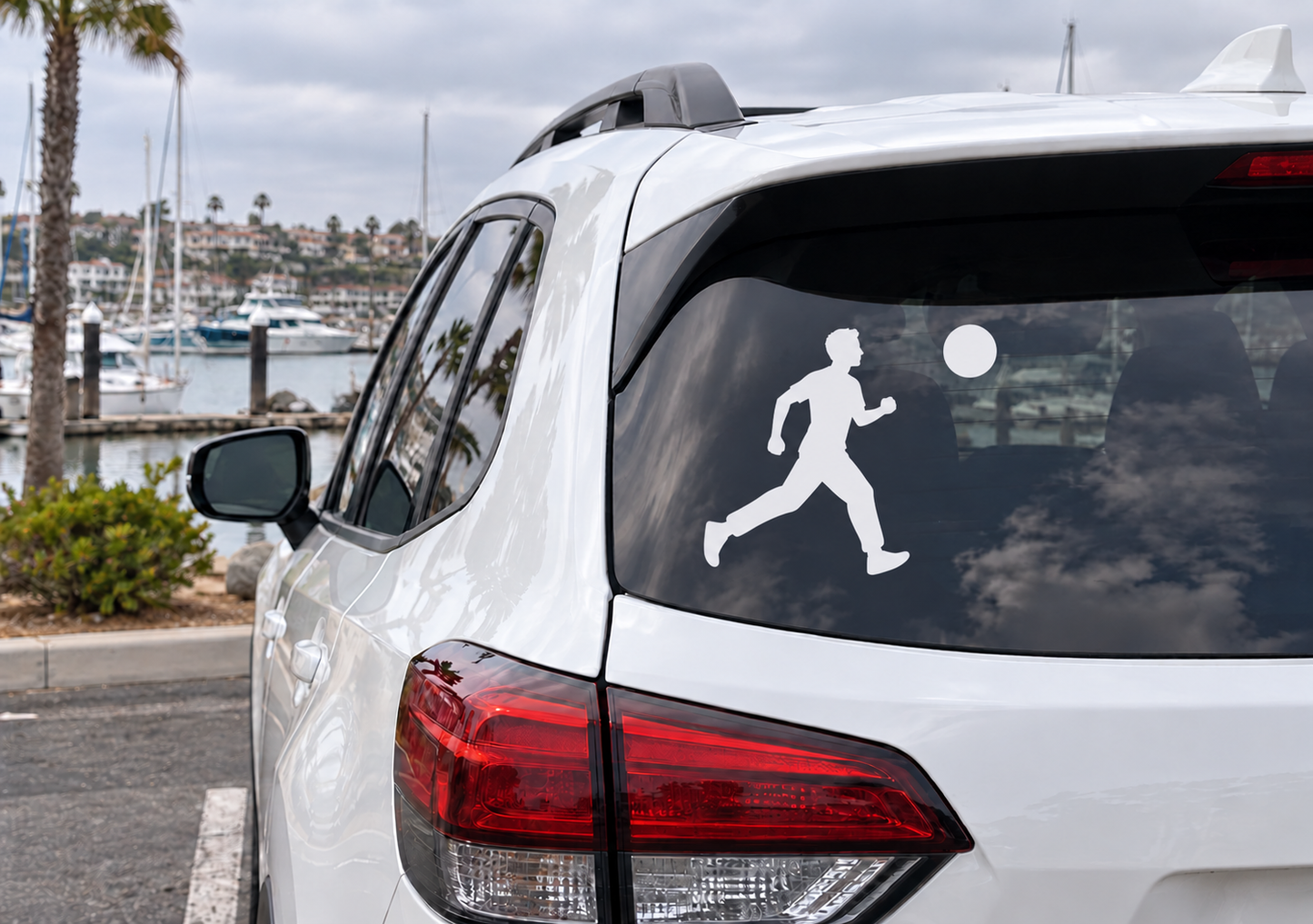 Parkour runner vinyl decal on car rear window, white silhouette with small circle