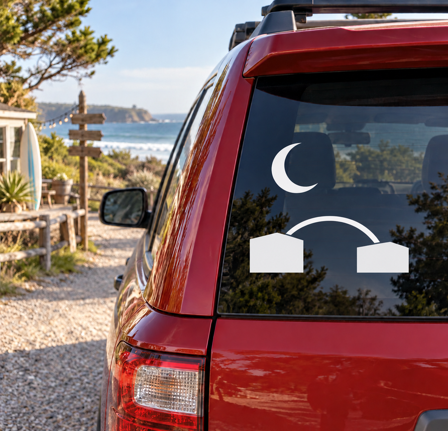 Car rear window vinyl decal with crescent moon, arch lines, and two block shapes