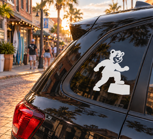 White bear parkour step-up vinyl decal on a dark car window