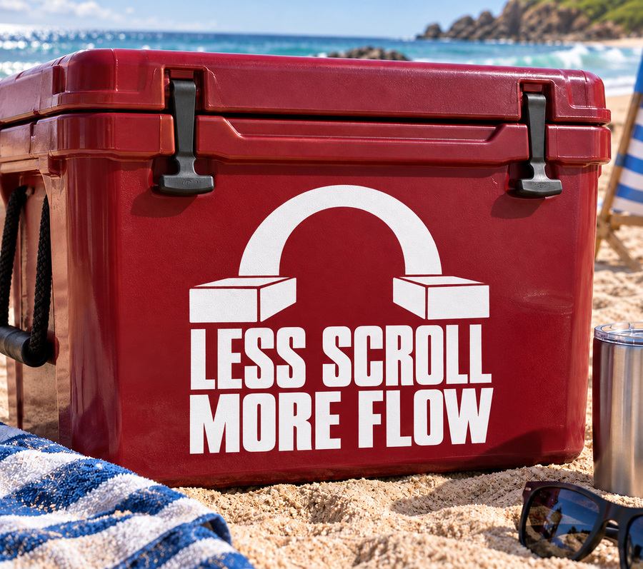 White vinyl decal with headphone arch and text 'LESS SCROLL MORE FLOW' on red surface