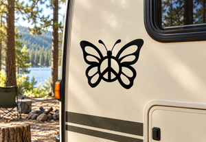 Black butterfly vinyl decal with peace symbol in the center on a camper