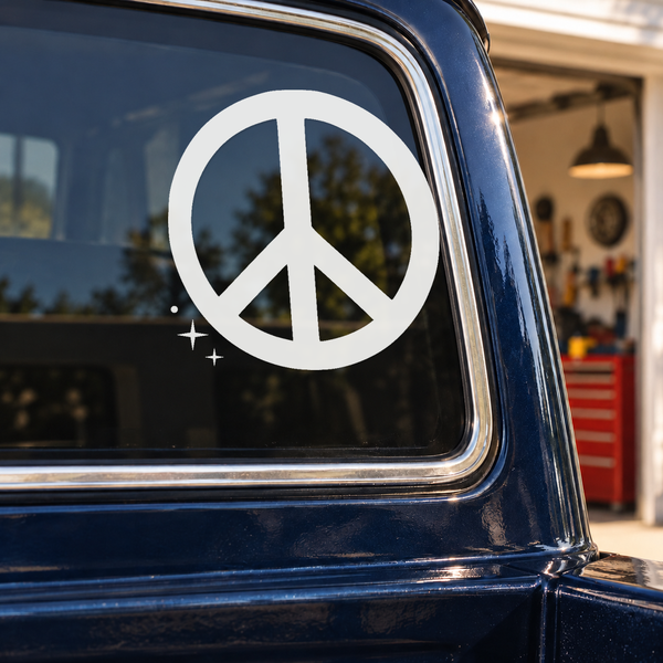 Peace sign decal with rounded ring and meteor spark trail on car window