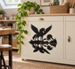 Black pegasus reflection vinyl decal silhouette on a cabinet door panel