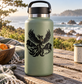 Phoenix and flames vinyl decal on a light green bottle