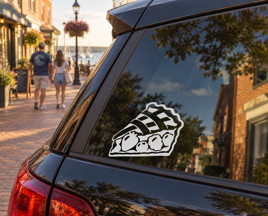 Vinyl decal on car window with black-and-white cartoon pizza slice graphic and eyes