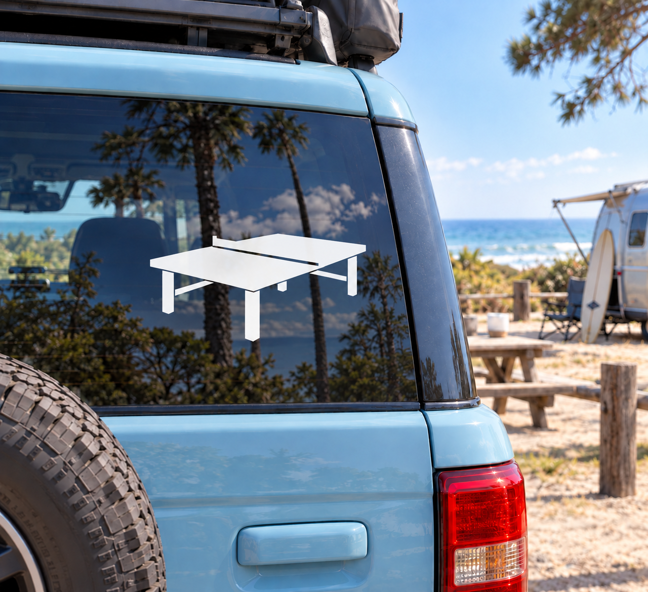 White vinyl ping pong table decal on vehicle window, with net and corner supports