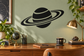Ringed planet vinyl decal, black planet with white stripes and curved Saturn-style rings