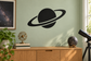 Black planet and orbit arc vinyl wall decal with ringed planet silhouette