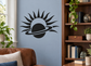Black and white vinyl decal of a planet with sunburst rays, wall sticker design