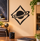 Black and cream planet-and-orbit vinyl decal in a diamond shape