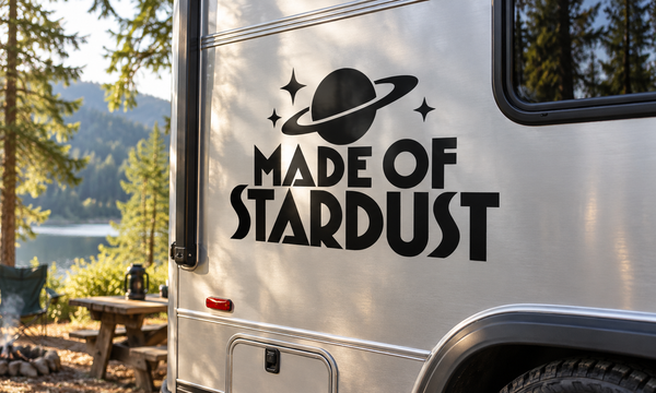 Made of Stardust vinyl decal on vehicle door with planet and sparkles