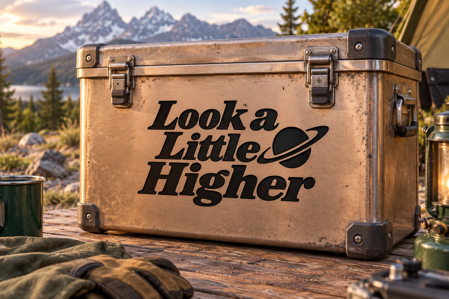 Vinyl decal with "Look a Little Higher" lettering and planet swoosh design