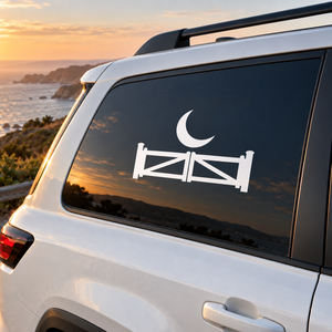 Car window vinyl decal with white crescent moon and gate barrier icon