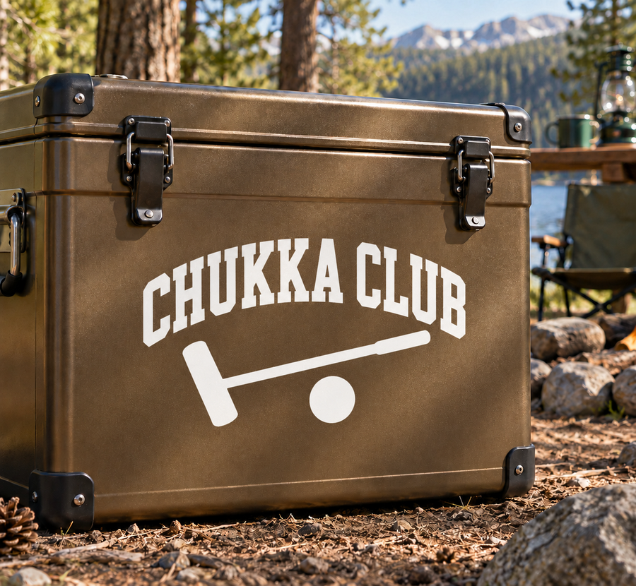 Vinyl decal with CHUKKA CLUB logo and mallet icon on brown suitcase