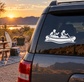 Rafting crew vinyl decal with two paddlers in a canoe on a car rear window