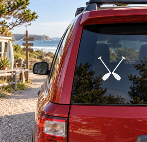 Rafting paddle pair vinyl decal with crossed white paddles on car window