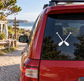Rafting paddle pair vinyl decal with crossed white paddles on car window