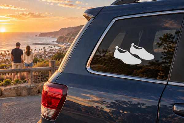 Vinyl decal of two black river shoes on a car window